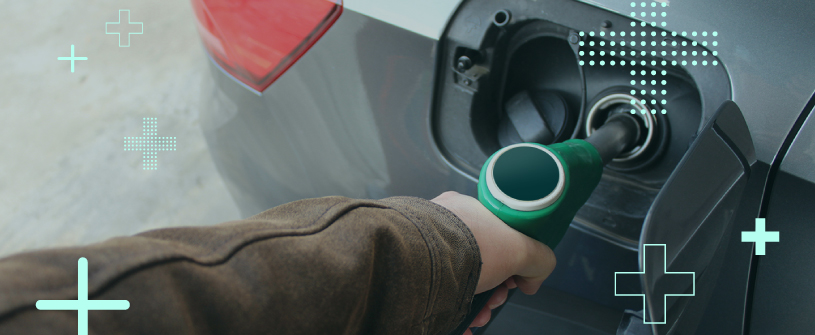 A gas pump inserted into a vehicle's gas tank.