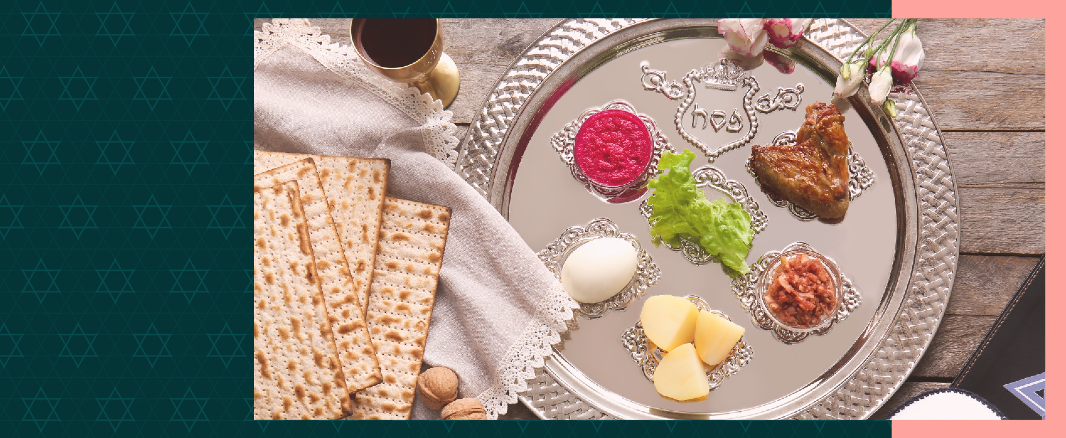 A plate with seder foods, with a side of crackers and wine.