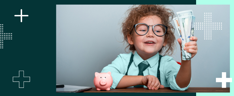 A child dressed professionally, holding money, with a piggy bank sitting beside them.